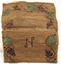 Handmade hessian bag fully open with embroidery around all the edges and an embroidered letter 'N' in the centre.