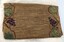 Back of closed handmade hessian bag with embroidery lining the two side edges.