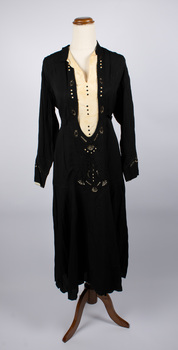 Front of black dress with a cream silk insert at the bodice