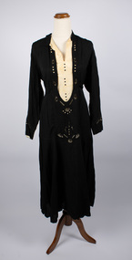 Front of black dress with a cream silk insert at the bodice