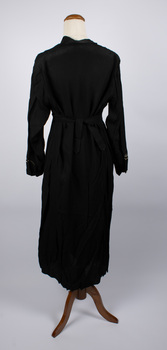 Back of black and white dress with a ribbon tie. 