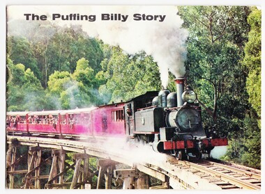 Photograph of Puffing Billy on the trestle bridge at Selby with bush in the background.