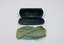 Open glasses case and opened out cleaning cloth