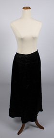 Front view of long black petticoat worn on mannequin