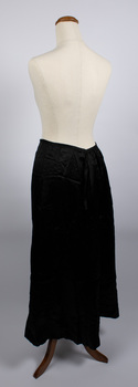 Side view of long black petticoat worn on mannequin
