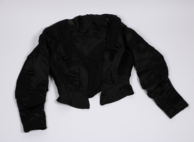 Front view of black bodice laid flat