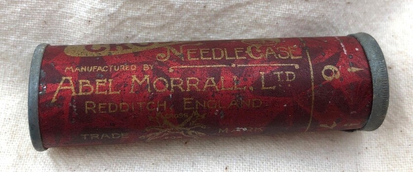 Back view of needle case with inscriptions visible.