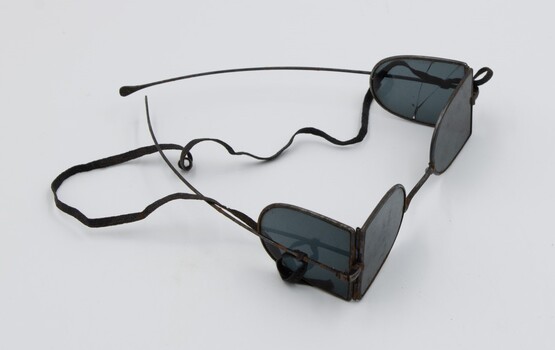 Side view of railway safety glasses with side lens and front lens visible.