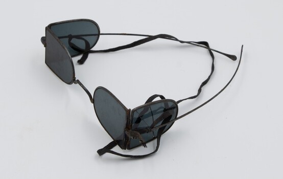 Side and above view of railway safety glasses with both side lens and front lens visible.