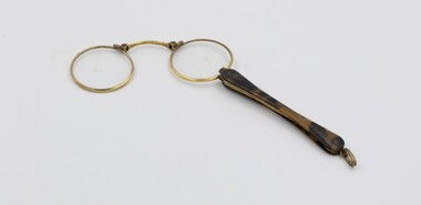 Lorgnette glasses opened for use.