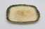 Cream colored plate with decorative green edging with gold rim.