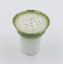 Ceramic pepper dispenser - green band with gold rim on white background.