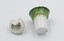 Ceramic salt cellar and lid both lying down with underneath exposed.