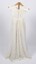 Front view of long cream-colored christening gown on a stand