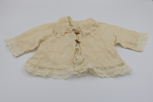 Front of Baby Jacket fastened with hooks and eyes.