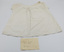 Front of baby bodice with handwritten label by Phoebe Lewell