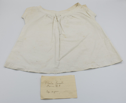 Front of baby bodice with handwritten label by Phoebe Lewell