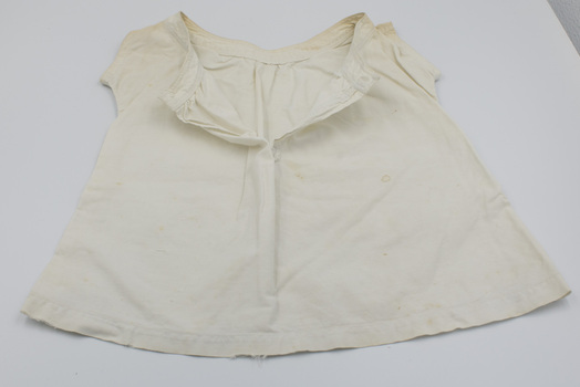 Front of baby bodice unbuttoned.