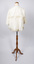 Back view of cream-colored ladies jacket showing sailor style of collar worn on mannequin.