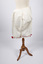 Back view of cotton drawers with red ribbon trim at knees
