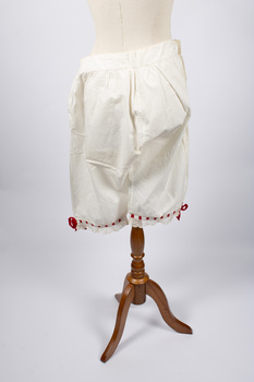 Back view of cotton drawers with red ribbon trim at knees