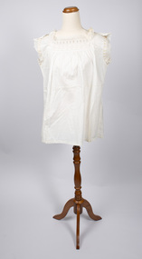 Front view of cream-colored chemise on mannequin