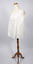 Angled view of cream-colored chemise on mannequin