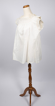 Angled view of cream-colored chemise on mannequin