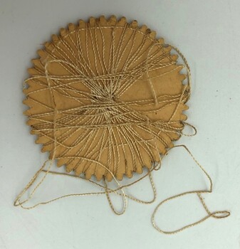Back of Semco embroidery thread wheel wound with golden thread