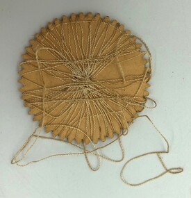 Back of Semco embroidery thread wheel wound with golden thread