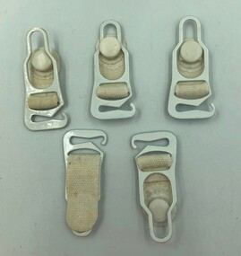 Five identical suspenders. Four are viewed from their front and one from its back.