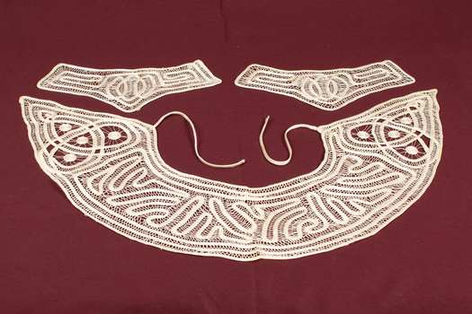 Lace collar with tape ties and two matching cuffs.