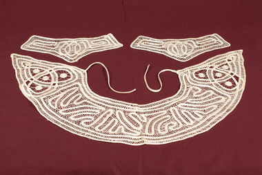 Lace collar with tape ties and two matching cuffs.