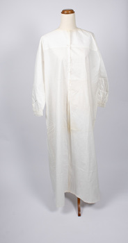 Front view of cream-colored nightdress - long with long sleeves.