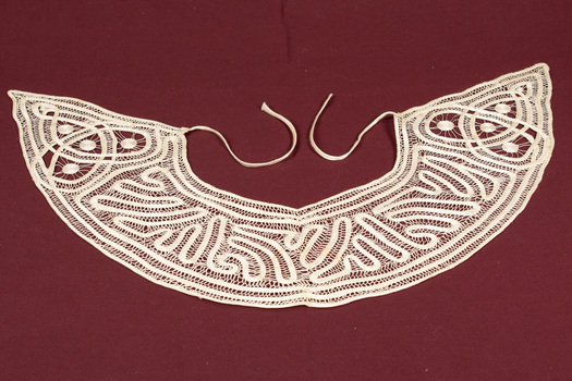 Back of lace collar with tape ties.