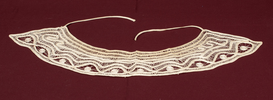 Lace collar with tape ties.