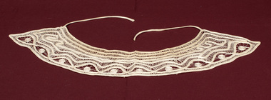 Lace collar with tape ties.
