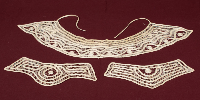 Lace collar and matching cuffs.
