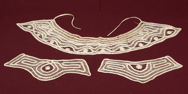 Lace collar and matching cuffs.