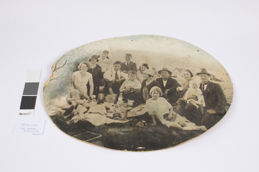 This is a sepia black and white photograph of Emerald Primary School attending a picnic in Mordialloc, Vic. The group of 13, are mainly of family members who are from the Hirst family.