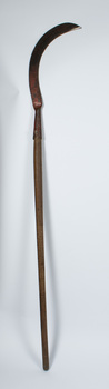 Scythe with curved blade upright