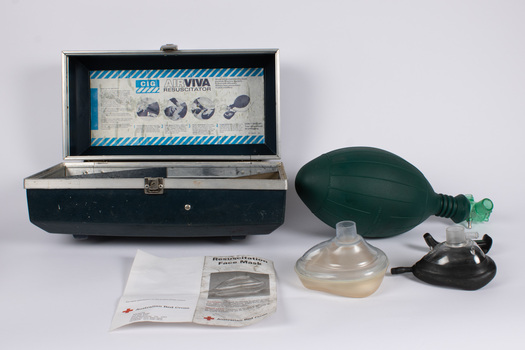 Case containing a manual air resuscitation kit - including two mouth pieces, manual air pump and instructions