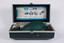 Case containing a manual air resuscitation kit - including two mouth pieces, manual air pump and instructions