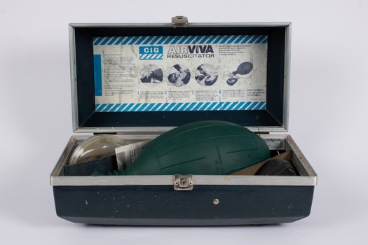 Case containing a manual air resuscitation kit - including two mouth pieces, manual air pump and instructions