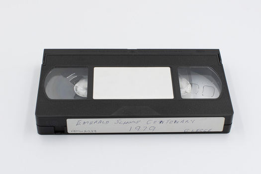 Top side of VHS tape with label visible on edge.