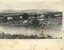 A black and white postcard featuring a road with background hills and foreground fields.