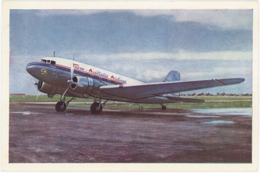 Side view of TAA airline on tarmac