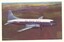 Side view of TAA airline in flight over a predominantly brown landscape