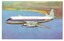 Side view of TAA airline, Vickers Viscount, flying over the ocean with the coast visible.