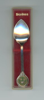 Silver-plated commemorative teaspoon inside clear plastic case.